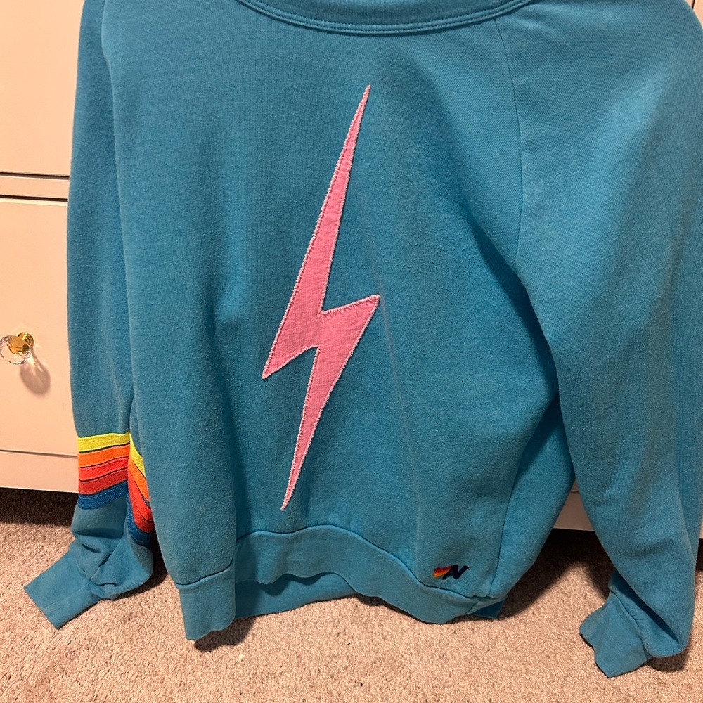 Blue Sweatshirt with Pink Lightning Bolt
